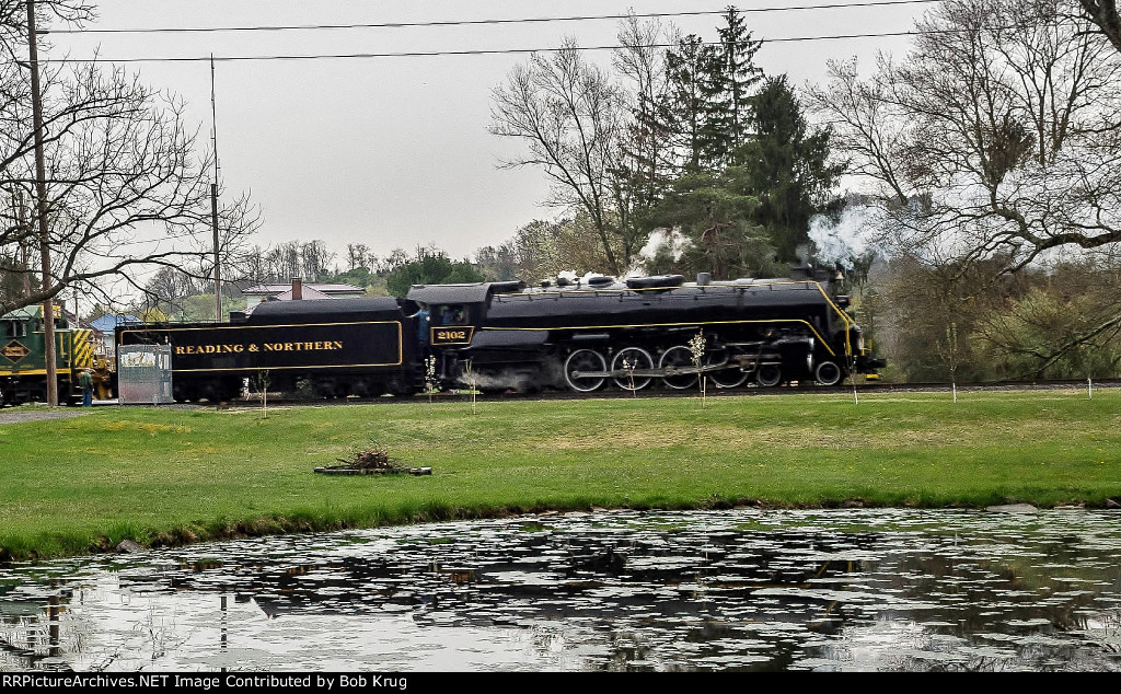 RBMN 2102 passing the Monastery Pond in Hecla